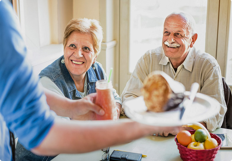 Residents enjoying chef-prepared dining together